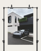 No. 00010 – The Grey Street Coupe – poster print mockup on a neutral wall.