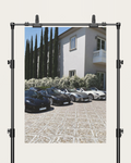 No. 00009 – The Estate Lineup – poster print mockup on a neutral wall.