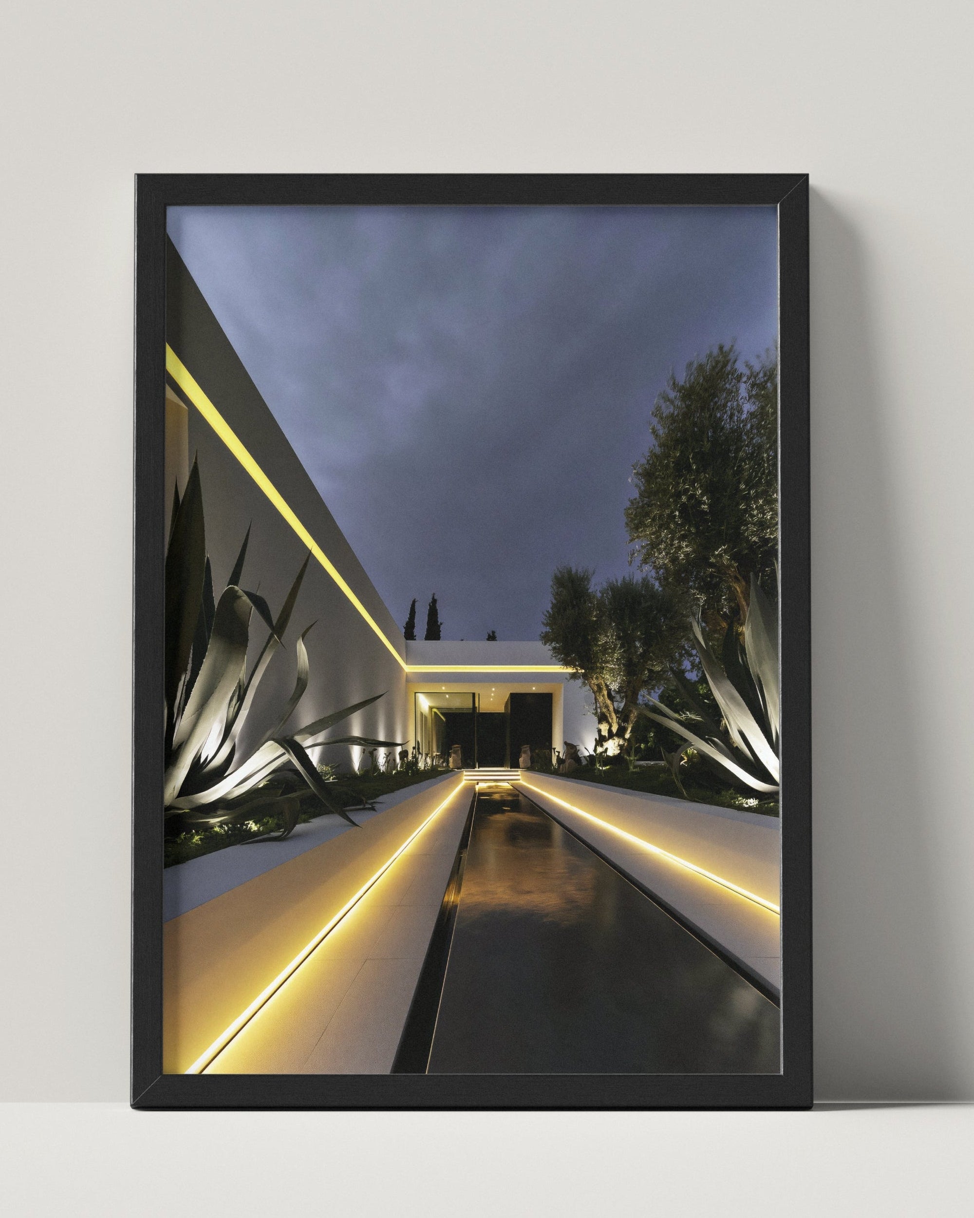 No. 00001 – Blue Hour Villa – framed print mockup in a calm modern interior.